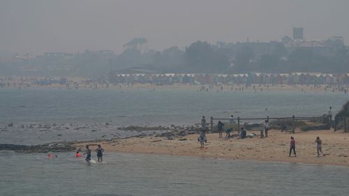 Smoke haze from bushfires is seen at Brighton Beach in Melbourne, Friday, January 3, 202