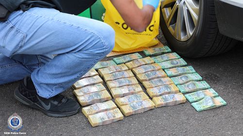 Police seized approximately $295,000 in cash in Homebush.