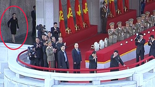Kim Yo Jong (left) can be seen in the background as North Korea holds military parade for key political anniversary in 2015. (AAP)
