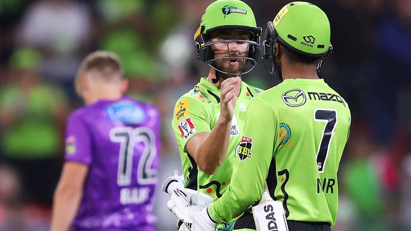 Alex Ross and Arjun Nair of the Thunder celebrate victory during the Big Bash League match