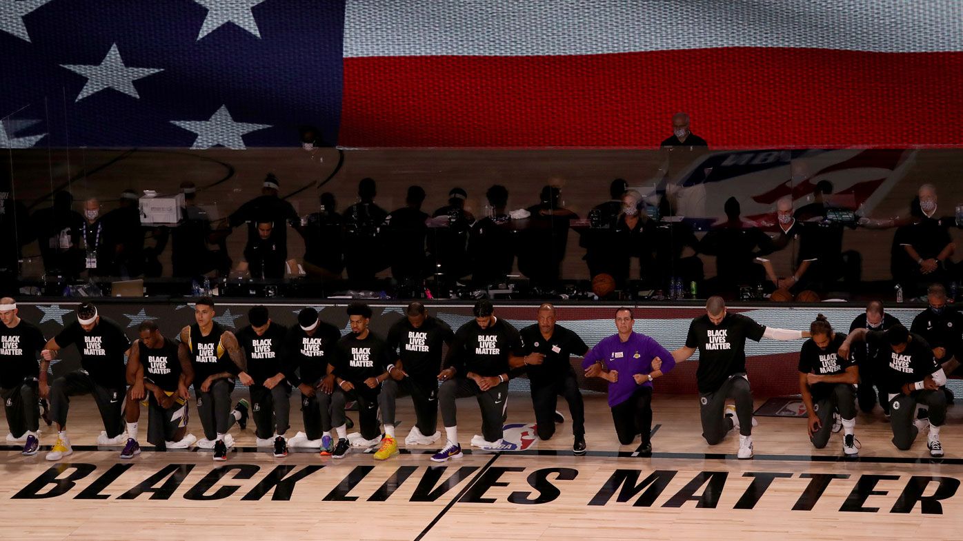 Players kneel in solidarity for the Black Lives Matter movement ahead of the NBA season restart. (Getty)