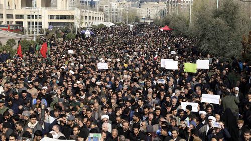 Mourners take to the streets in Tehran to mourn Qassem Soleimani and protest his assassination. 