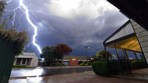 This photo shows lightning strike a metal chimney on a factory roof in Ridleyton, Adelaide. (David Stevenson)
