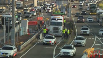Truck stuck before Sydney Harbour Tunnel causes commuter chaos.