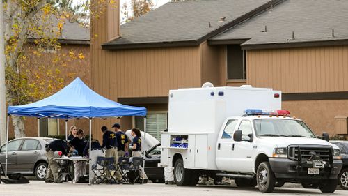 FBI agents outside a home in Redlands, California, linked to the shootings. (AAP)