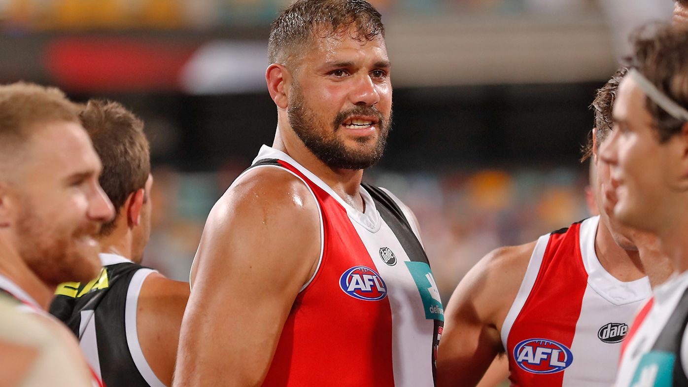 Paddy Ryder of the Saints is consoled by teammates after injuring himself