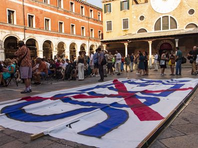 People participate in the protest against the wedding of Jeff Bezos in Venice, Italy, on June 13, 2025 
