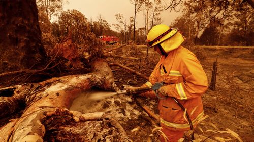 CFA fire crews put out spot fires on January 04, 2020 in Sarsfield, Australia.Evacuations Continue Across East Gippsland As State Of Disaster Is Declared