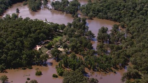 A man has died after his car became trapped in floodwaters in Glenorie.