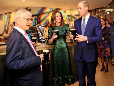 Prince William, Duke of Cambridge and Catherine, Duchess of Cambridge hold a pint of Guinness as they visit the Guinness Storehouses Gravity Bar