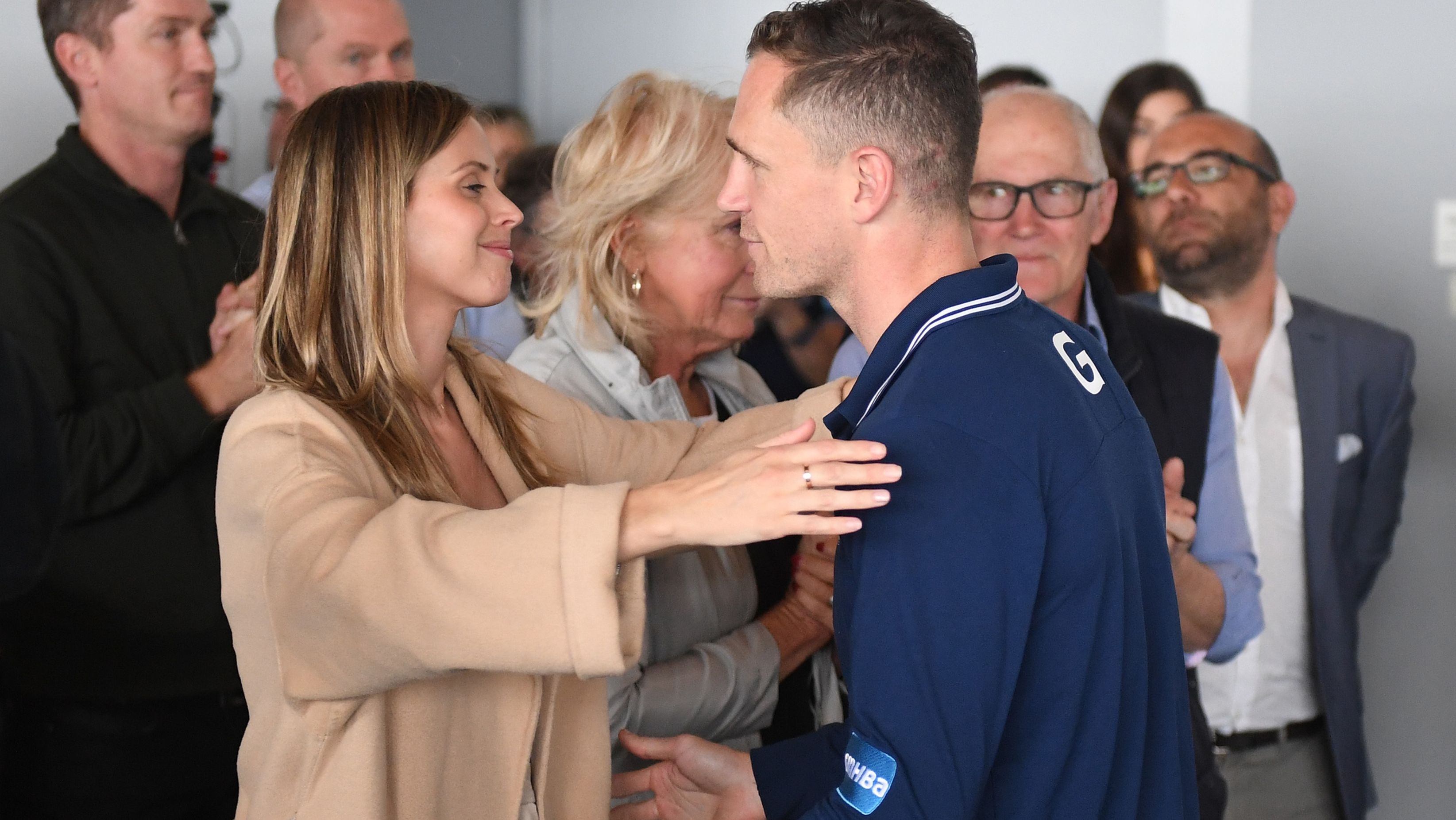 Brit Selwood embraces Joel Selwood of the Cats as he announces his retirement.