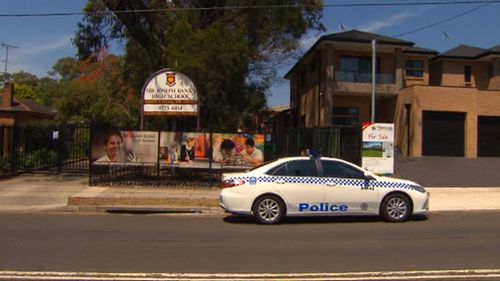 Two Sydney high schools remain in lock down following terror threats