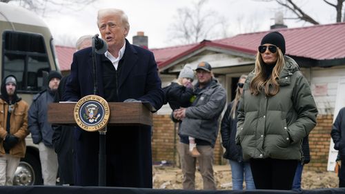 President Donald Trump speaks along side first lady Melania Trump, as they meet with homeowners affected by Hurricane Helene in Swannanoa, N.C., Friday, Jan. 24, 2025. (AP Photo/Mark Schiefelbein)