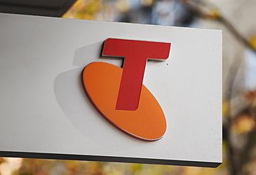 How many employees does Telstra have, according to its 2023 annual report?