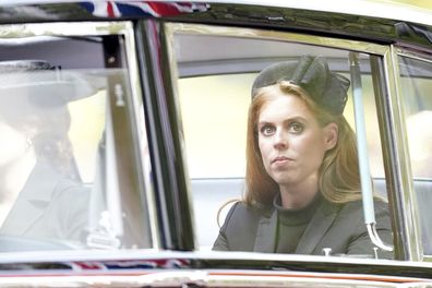 Princess Beatrice sits in her car as it follows the State Gun Carriage carrying the coffin of Queen Elizabeth II in the Ceremonial Procession following her State Funeral at Westminster Abbey, in London, Monday Sept. 19, 2022. 