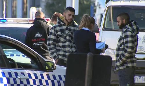 The men involved in the alleged attack speak with detectives. Picture: 9NEWS