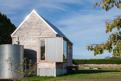 It looks like a tiny Tassie shed from the outside, but inside it is a designer home