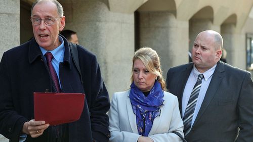 Denise Fergus, the mother of murdered toddler James Bulger and her husband Stuart (right), listen as a statement is read out, outside the Old Bailey in London following Venables' sentence. (Photo: PA).