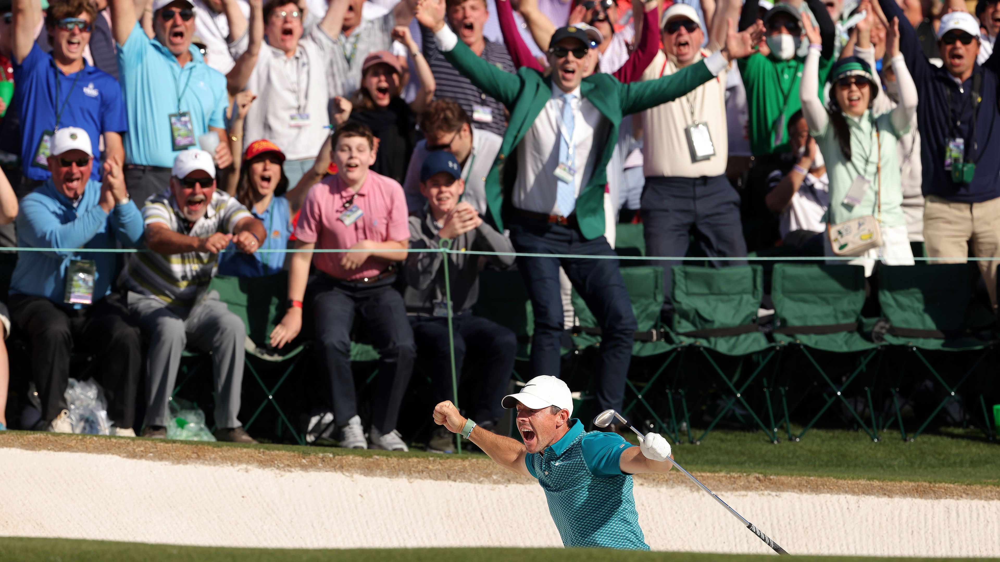 Rory McIlroy reacts after chipping in for birdie from the bunker on the 18th green during the final round of the Masters at Augusta.