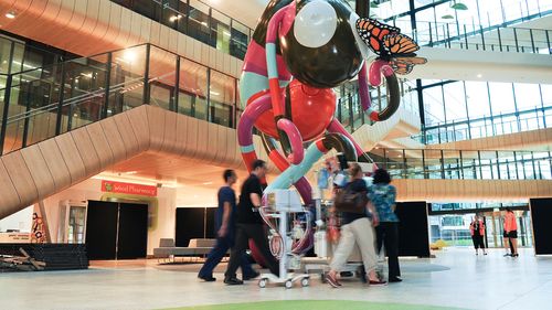 A patient is transferred through Main Street at the Royal Children's Hospital in Melbourne. (AAP)