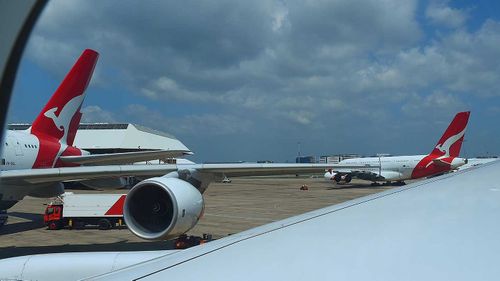 Qantas planes on the tarmac.