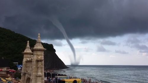 Russian holidaymakers have been treated to a terrifying sight after a giant waterspout formed a small distance from a seaside resort. Picture: Ruptly