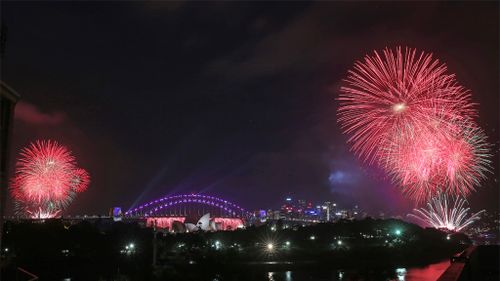 Fireworks explode around the Sydney Opera House and Harbour Bridge as New Year's celebrations get underway in Sydney at 9pm. (AAP)