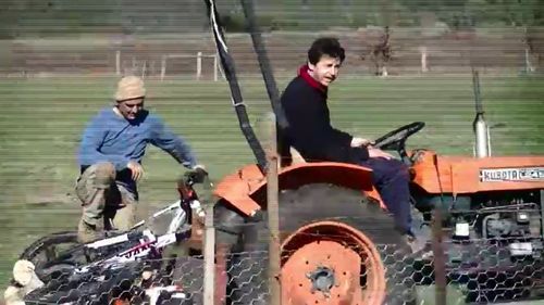 The neighbours have been filmed shouting abuse at the Freeman's property on a tractor.