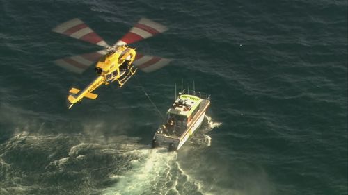 A light aircraft ditched into the ocean off Perth's City Beach with a pilot and passenger on board escaping