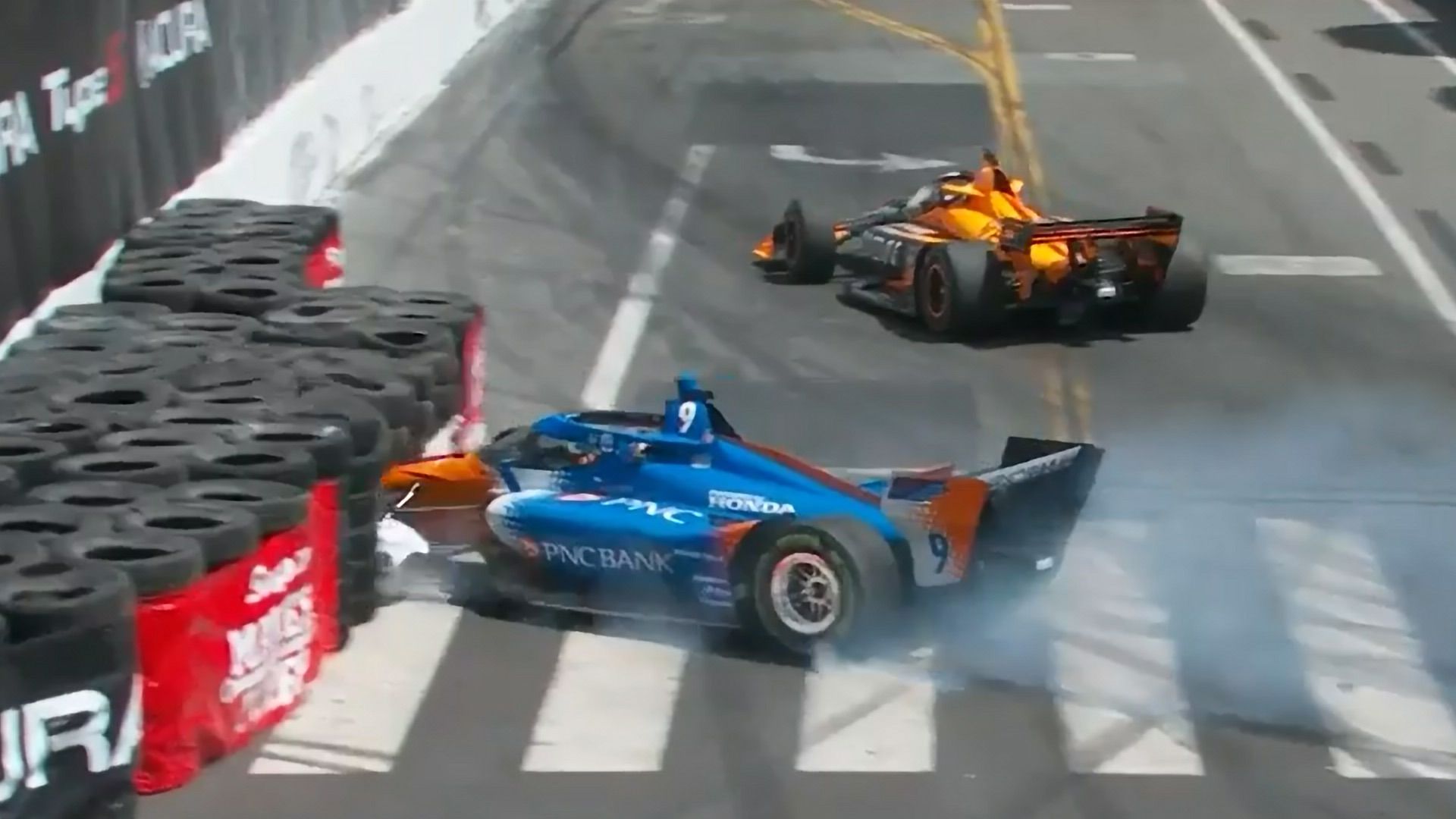 Scott Dixon&#x27;s car gets buried in the tyre wall after contact from Pato O&#x27;Ward.Scott Dixon&#x27;s car gets buried in the tyre wall after contact from Pato O&#x27;Ward.