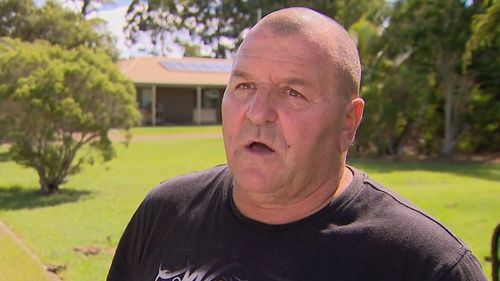 Neighbour Douglas Hutchings helped police put the injured woman into an ambulance. Burpengary East