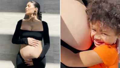 Kylie Jenner displays baby bump in pregnancy video with daughter Stormi.