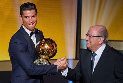 A delighted Ronaldo shakes hands with FIFA president Sepp Blatter.