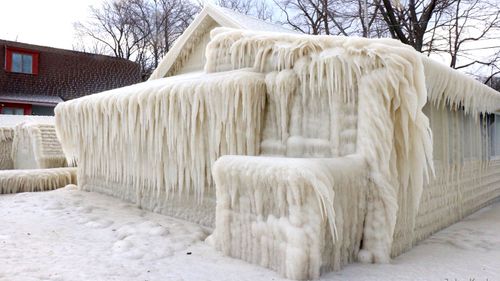 Lakefront home caked in ice as US braces for monster storm