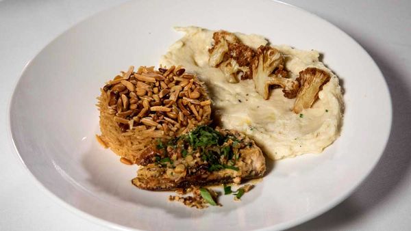 The Sharouk's tahini baked samka hara fish, sayidiya rice, cauliflower and potato mash with fried cauliflower