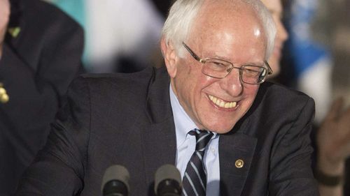 Bernie Sanders grins after winning the New Hampshire primary. (AAP)