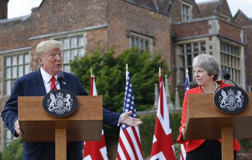 Mr Trump and Mrs May put on a happy face, but the president's UK trip has been marred by protests and incendiary newspaper interviews he has given. Picture: AAP