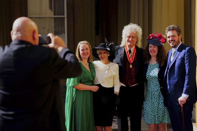 Sir Brian May poses with his family, including wife Anita Dobson, after being made a Knight Bachelor by King Charles III during an investiture ceremony at Buckingham Palace, London, Tuesday March 14, 2023.