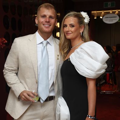 Jackson Warne and Kiah Broadsmith pose for a photo during 2025 Melbourne Cup Day at Flemington Racecourse on November 4, 2025 in Melbourne, Australia