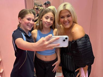 Ellen Malone with young fans at a Sydney beauty event.