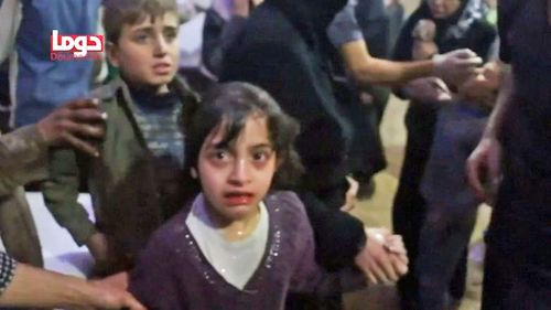 A screenshot of Masa after she and her family members were sprayed with water by doctors. 