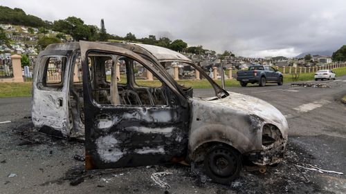 The gutted remains of a car after unrest in Noumea, New Caledonia, Wednesday May 15, 2024. France has imposed a state of emergency in the French Pacific territory of New Caledonia. The measures imposed on Wednesday for at least 12 days boost security forces' powers to quell deadly unrest that has left four people dead, erupting after protests over voting reforms. (AP Photo/Nicolas Job)