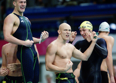 Michael Klim, Chris Fydler, Ashley Callus and Ian Thorpe celebrate 4x100m freestyle relay victory at the Sydney Olympics with guitar moves