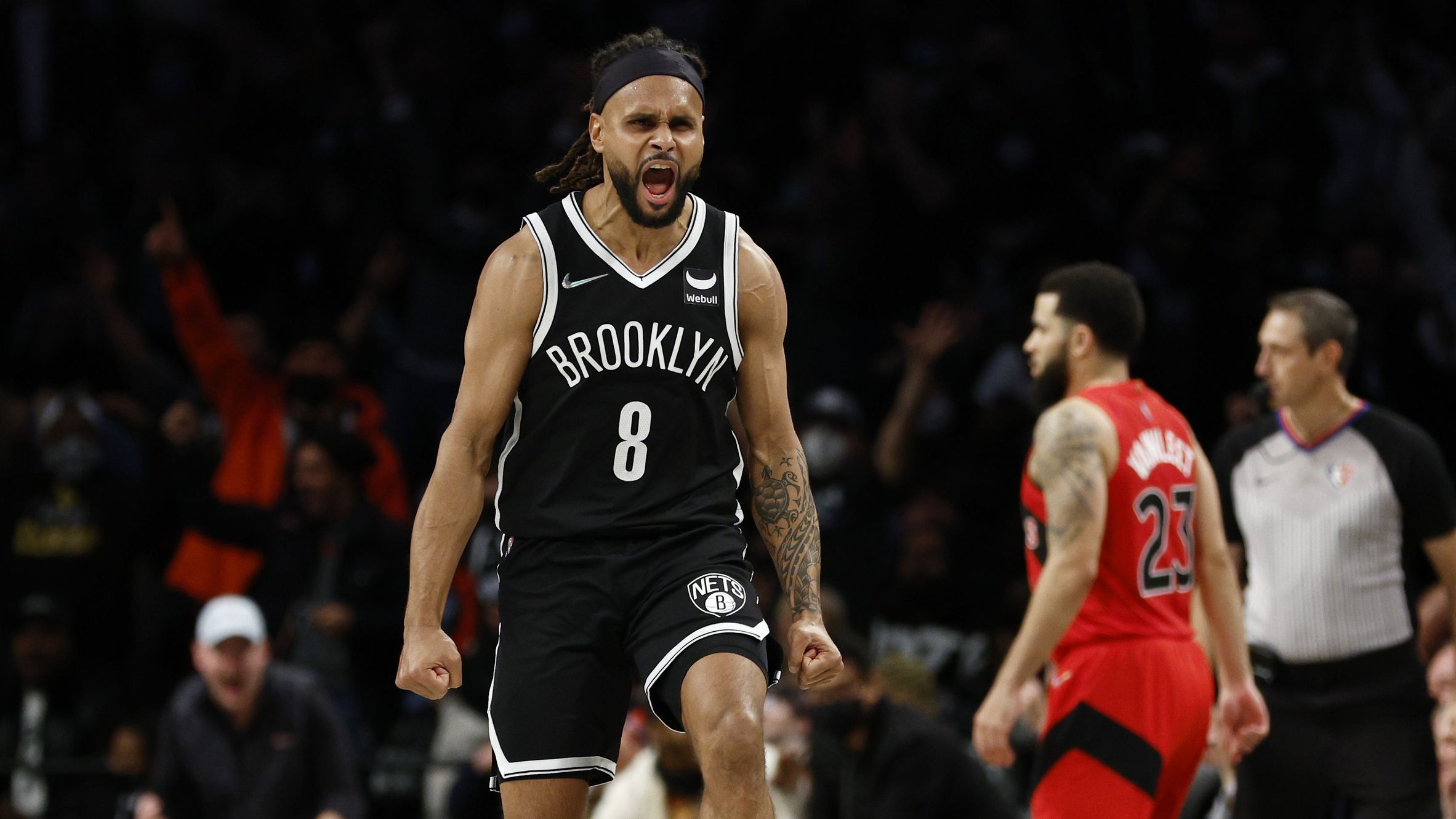 Patty Mills of the Brooklyn Nets reacts after making a three-pointer against the Toronto Raptors.