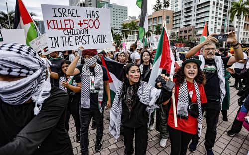 Palestinian supporters rally for Palestinians in Gaza during the conflict between Israel and Hamas at the Torch of Freedom in Bayfront Park in Miami on Friday, Oct. 13, 2023. (Al Diaz/Miami Herald via AP)