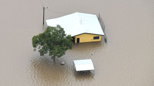 Houses are inundated with flood waters in Ingham. (AAP)