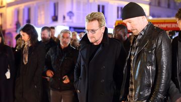 U2 have laid flowers at the Bataclan Theatre where 82 died in the Paris attacks on Friday. (AAP)