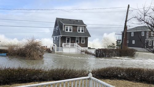 Waves crashed into Scituate in Massachusetts on Sunday as the Nor'easter brought widespread flooding. (AAP)