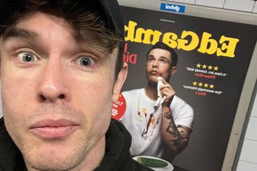 UK comedian Ed Gamble in front of his changed poster