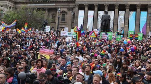 Supporters join in the marriage equality rally in Melbourne. Saturday, August 26, 2017. (AAP)